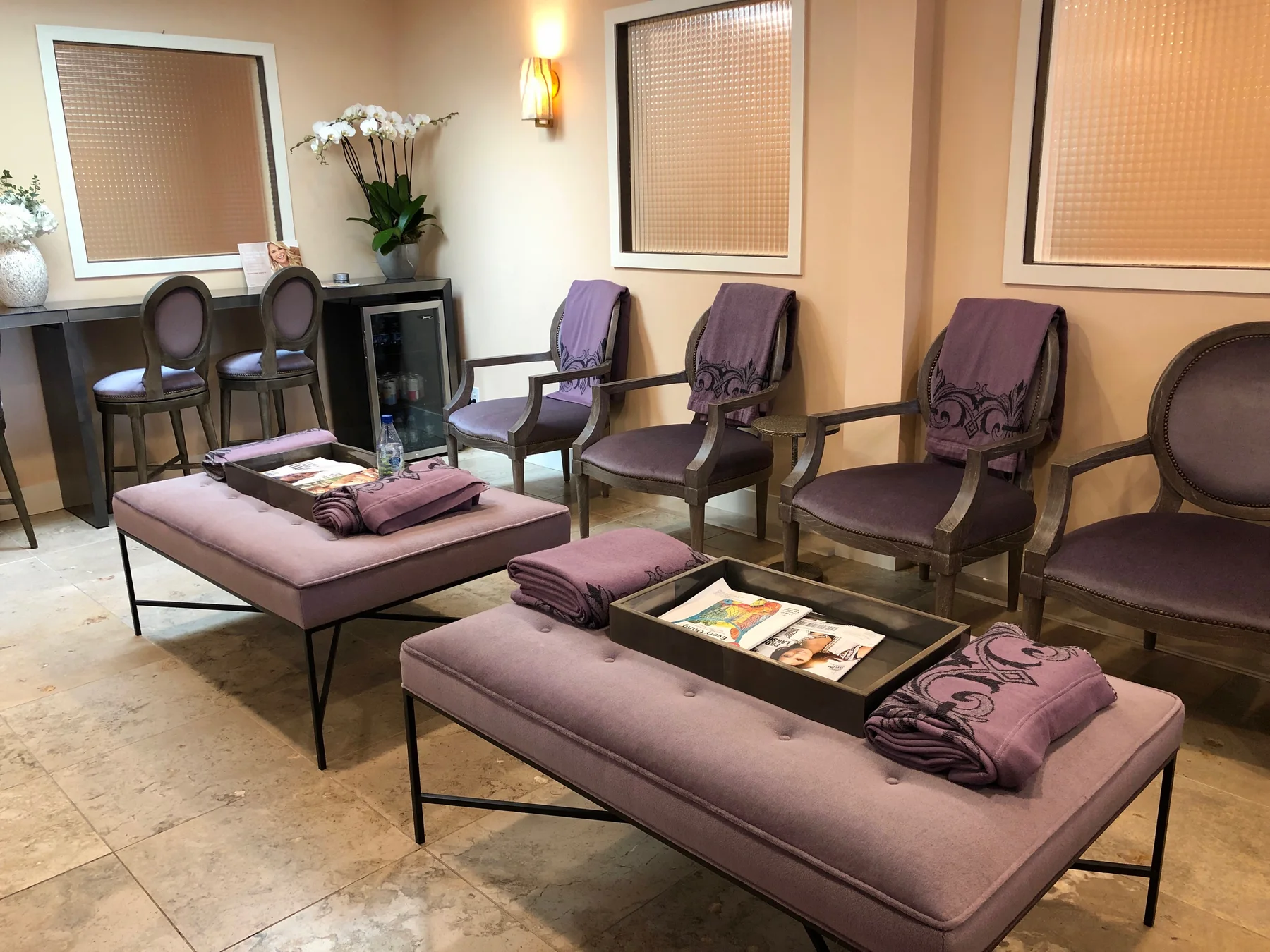 Formal sitting room with lavender chairs and matching benches